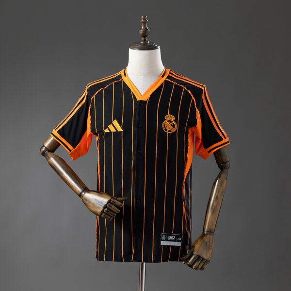 41c4b52b52-1.jpg 2025-26 REAL MADRID BLACK AND ORANGE US PACK FAN VERSION