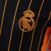 2025-26 REAL MADRID BLACK AND ORANGE US PACK FAN VERSION