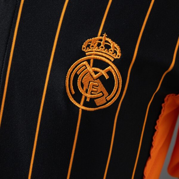 2025-26 REAL MADRID BLACK AND ORANGE US PACK FAN VERSION
