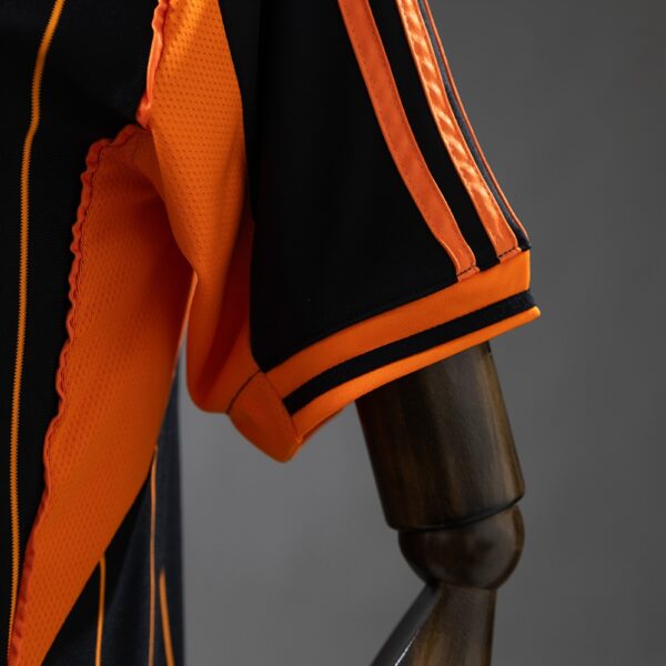 2025-26 REAL MADRID BLACK AND ORANGE US PACK FAN VERSION