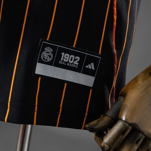 2025-26 REAL MADRID BLACK AND ORANGE US PACK FAN VERSION